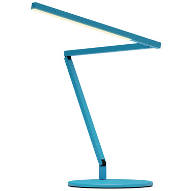 The Koncept Z-Bar Mini Gen 4 desk lamp's touchstrip dimmer, located on the head, with a hand adjusting the brightness for a dimmable LED light - Blue finish.