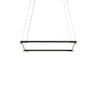 Long customizable black LED pendant floating in a contemporary minimalist hotel lobby design.