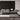 Zanuso table lamp on a coffee table in a gray living room