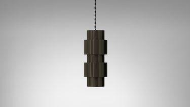 Ring pendant in bronze with stacked metal rings on a black silk braided flex, studio view
