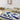 Alpha wool rug in Blue, styled in a room