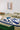 Alpha wool rug in Blue, styled in a room
