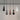 Minimalist white hanging light fixture inspired by contemporary jewelry design