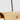 Close-up of Ambrose 72 linear chandelier's solid brass frame and integrated LED strip for energy efficiency.