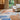 Bleu des Yeux wool rug in Multi, styled in a room