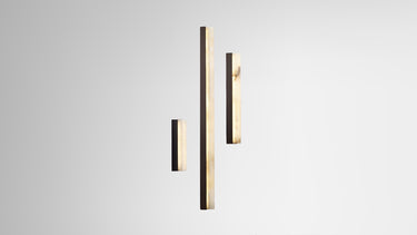 Three Artes wall lights in different lengths in bronze, with alabaster diffusers, studio view