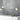 Ivy 3 pendant with lit opal glass globes above a white console against a gray wall