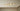 Group of Anvers ceiling lights in satin brass in different sizes on a pale ceiling