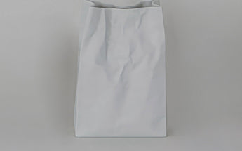 Empty, showing the crumpled paper-bag folds · Crinkle Vase, Ceramic Japan (view 1)