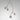 Ivy Vertical 4 pendant in bronze with satin brass details and 4 smoked glass globes, studio view