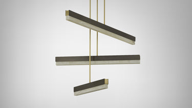 Artes Collective pendant in bronze with satin brass details, three alabaster bars hung at staggered heights, studio view