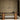 Three Anvers pendants hanging in a row above a dark oval dining table