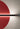 Detail of the Penta Hang Out wall lamp with a red half-disc panel and black bar