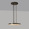 Anvers pendant in bronze with a honed alabaster disc, studio view