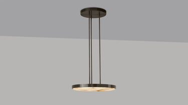 Anvers pendant in bronze with a honed alabaster disc, studio view