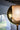 Close detail of the Penta Glo floor lamp glass sphere and its reflections