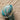 Ladenac Bois de Russie 220 g egg – Espiral Blue egg on a sculpted surface