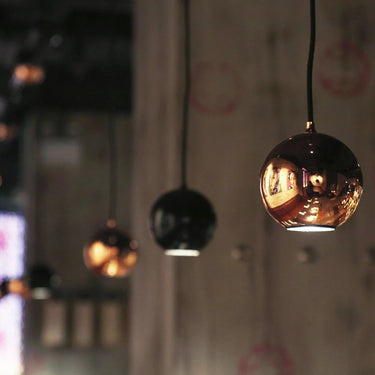 Innermost Boule space-saving hanging lamp, sleek design for small apartments, hallways, or entryways.