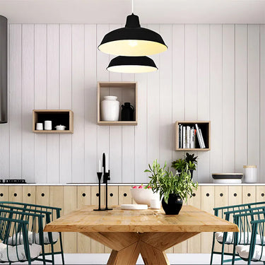Series of Innermost Foundry 40 black pendants in a commercial hotel lobby