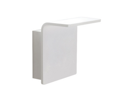 Innermost Bracket WB0883-01 LED wall light in matte white finish, casting warm ambient glow upwards and downwards in a modern living room.