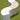 Three white Arc modules arranged in an S-curve on a green lawn