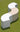 Three white Arc modules arranged in an S-curve on a green lawn