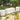 White Dash bench and Dot cylinder ottoman on stone steps in a tropical garden with orchids