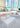 White Dot 2 cubes and a Dash bench on a plaza beside a circular lounge and high-rise towers