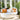 Round white vinyl Sun Pad with a Stack drum, orange and cream pillows in a sunroom opening to a patio