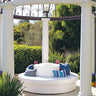 Round Sun Pad topped with a Stack drum as a circular seating group inside a garden gazebo