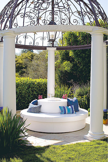 Round Sun Pad topped with a Stack drum as a circular seating group inside a garden gazebo