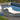 Surf lounge with its pillow beside a pool