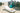 White Surf sun lounge on sand in front of weathered posts with a teal ball and a folded towel