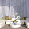 Zen Club Now cabana set in white vinyl: a U-shaped daybed sectional with bolsters and a round floor pad under sheer curtains