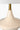 Oliver Cordless Table Lamp Antique Brass illuminating a living room
