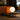 16-inch Bola Sphere Table Lamp by Pablo Designs, orange sofa environmental photo