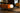 16-inch Bola Sphere Table Lamp by Pablo Designs, orange sofa environmental photo