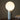 Pilar table lamp by Pablo on a walnut table, landscape photograph