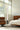 Black Elise floor lamp by Pablo in an Eames chair setting