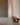 Elise floor lamp by Pablo beside a walnut bench