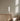 Elise table lamp by Pablo beside an oak cabinet