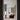 Solis Flush in black by Pablo near an oak bookcase