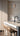 Totem Mini up/down pendant in etched smoke by Pablo in an oak kitchen