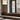 Totem Mini up/down pendant by Pablo over a marble table by a window bench