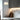 Totem Mini pendant in white by Pablo over a grey kitchen island