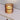 Totem Table Mini amber lamp by Pablo above a credenza