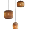 Cluster of Natural Ausi cardboard pendants hung at varied heights from one canopy, Graypants Scraplights