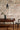 Barro handmade clay pendant glowing in a styled room