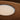 Detail of the layered recycled cardboard edge on a Float 48 in pendant by Graypants, Natural