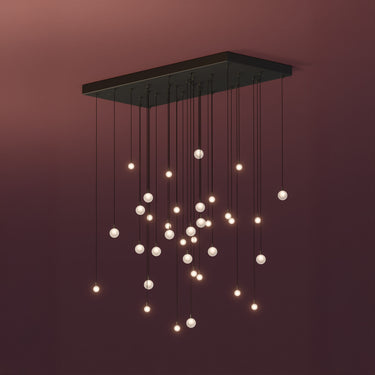 Graypants Loci Galaxy LED chandelier with black canopy, studio view